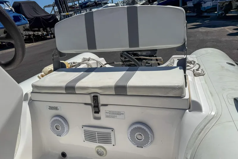 Slide: The Image of 2021 AB Inflatables Oceanus 14 VST boat with cushioned seating and speakers. - 16