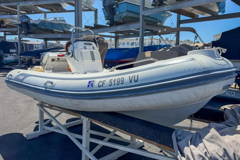 Slide: The Image of 2021 AB Inflatables Oceanus 14 VST boat on storage rack in marina. - 6