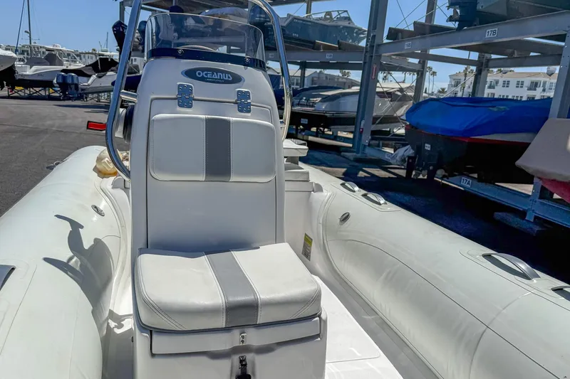 Slide: The Image of 2021 AB Inflatables Oceanus 14 VST boat in storage, featuring a sleek white design. - 7