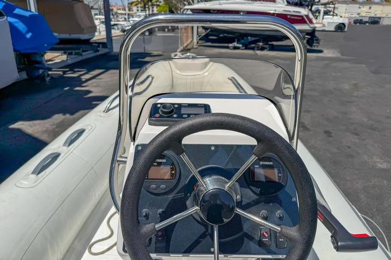Slide: The Image of 2021 AB Inflatables Oceanus 14 VST boat dashboard with steering wheel and controls. - 8