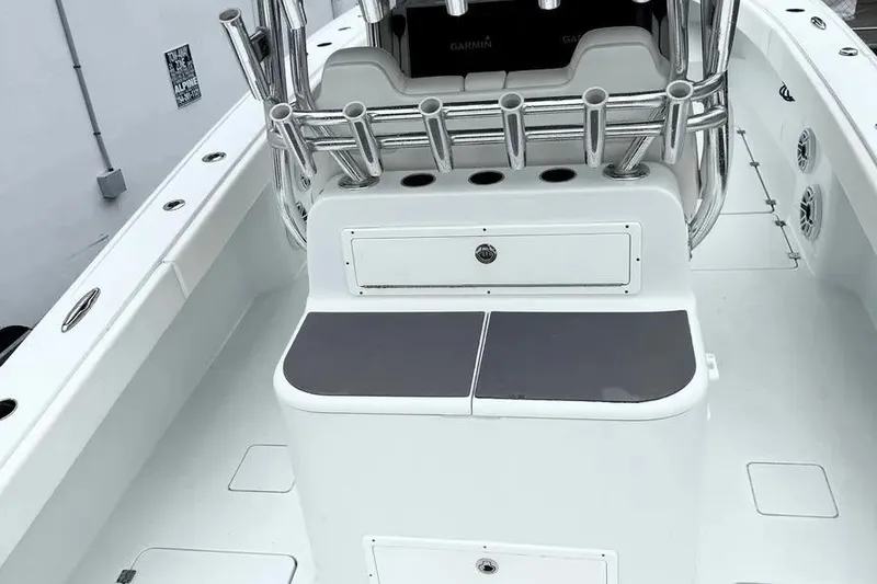 Slide: The Image of 2022 Freeman 34VH boat interior with rod holders and seating area. - 10