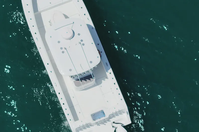 Slide: The Image of Aerial view of 2022 Freeman 34VH boat on clear blue water. - 18
