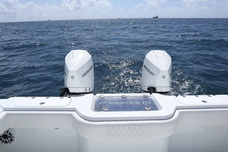 Slide: The Image of Freeman 34VH 2022 boat with dual Mercury engines on open sea. - 19