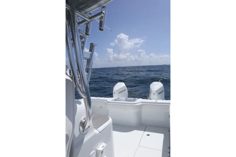 Slide: The Image of 2022 Freeman 34VH boat with Mercury engines on open sea under clear sky. - 21