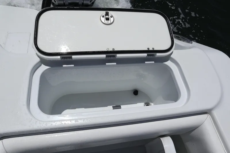 Slide: The Image of Open storage compartment on a 2022 Freeman 34VH boat, showing interior details. - 30