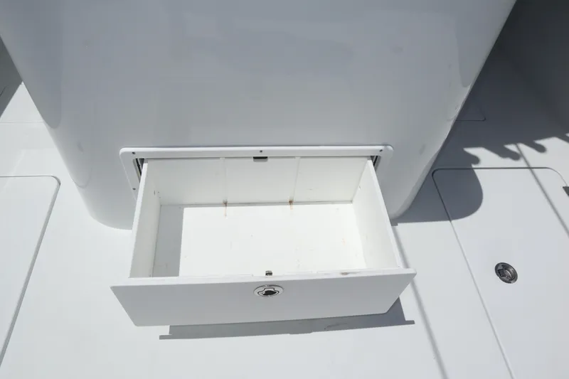Slide: The Image of Open storage compartment on 2022 Freeman 34VH boat deck. - 45