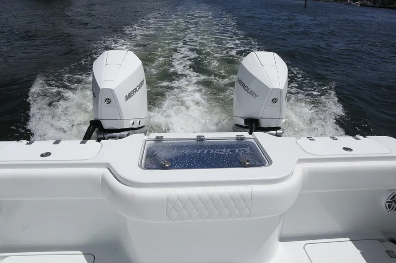 Slide: The Image of Freeman 34VH 2022 boat with dual Mercury engines on water. - 47