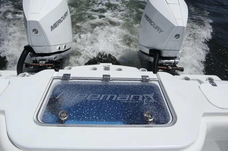 Slide: The Image of Freeman 34VH boat with dual Mercury engines, 2022 model, on water. - 48