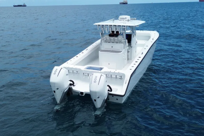 Slide: The Image of 2022 Freeman 34VH boat with dual engines on open sea. - 6