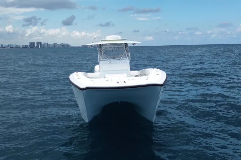 Slide: The Image of Freeman 34VH 2022 boat on open sea with city skyline in background. - 8