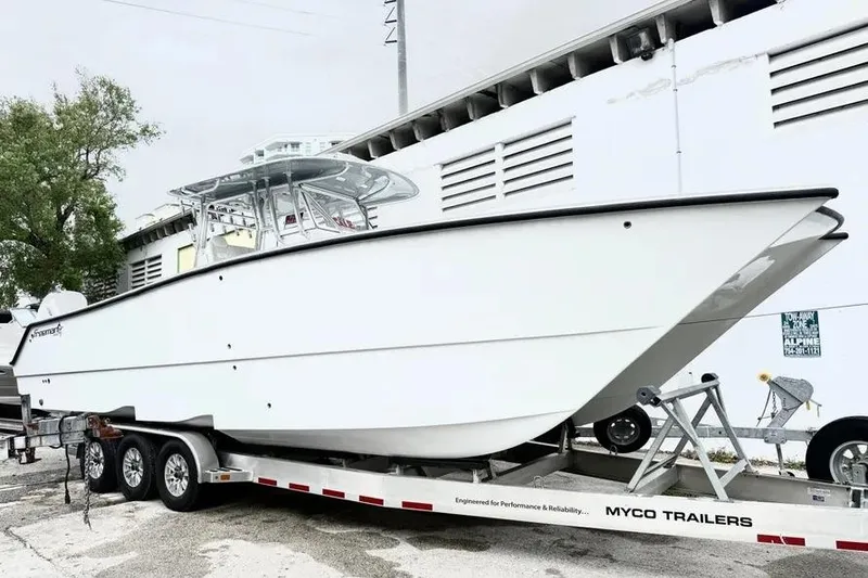 Slide: The Image of 2022 Freeman 34VH boat on Myco trailer, parked outdoors. - 9