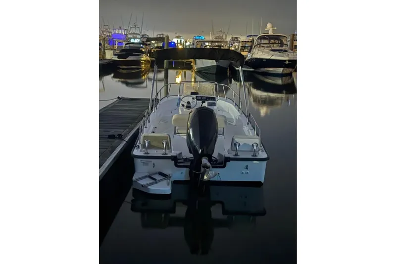 Slide: The Image of 2022 Boston Whaler 170 Montauk docked at marina during evening. - 4