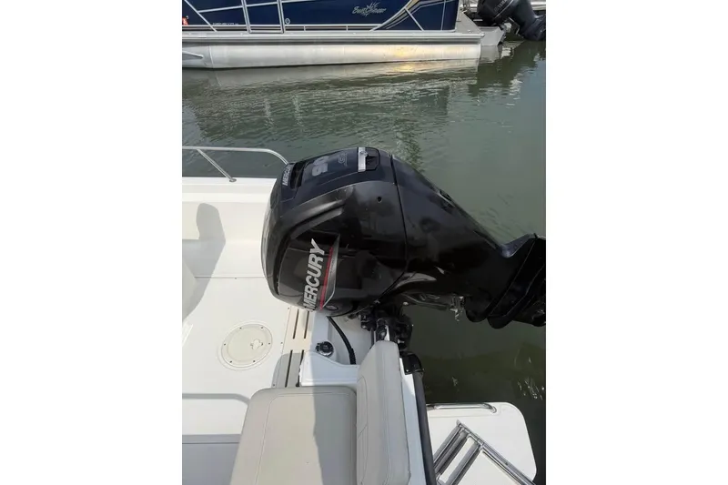 Slide: The Image of 2022 Boston Whaler 170 Montauk with Mercury outboard motor at dock. - 5