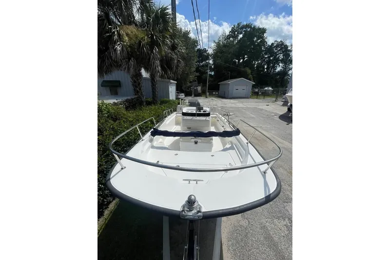 Slide: The Image of 2022 Boston Whaler 170 Montauk boat on trailer, parked outdoors. - 9