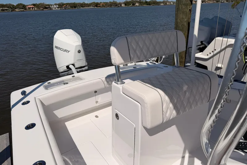 Slide: The Image of 2024 Stoner 23 CC boat with Mercury engine, featuring elegant seating and sleek design. - 12