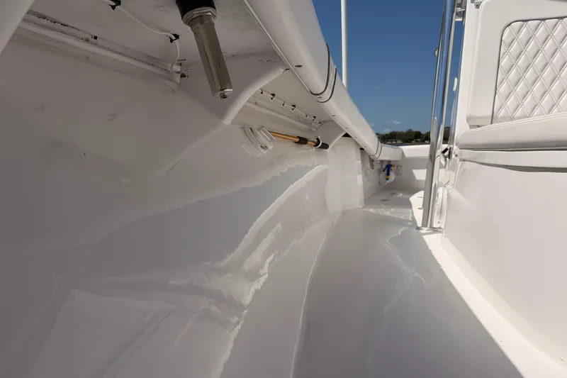 Slide: The Image of 2024 Stoner 23 CC boat interior with sleek white finish and modern fittings. - 19
