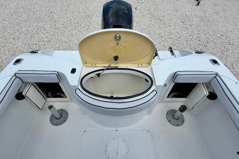 Slide: The Image of 2003 Seaswirl Striper 2101 CC boat interior with open storage compartments and seating. - 20