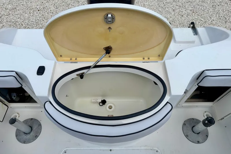 Slide: The Image of 2003 Seaswirl Striper 2101 CC boat's open storage compartment on deck. - 21