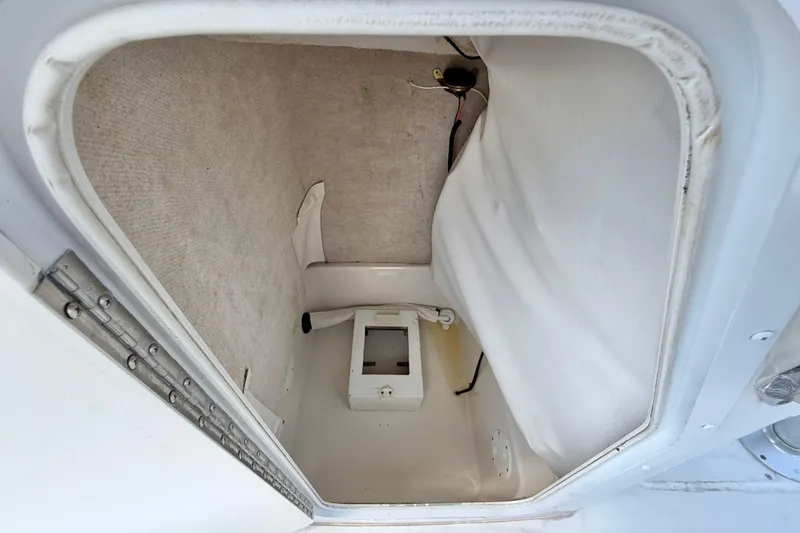 Slide: The Image of Storage compartment inside a 2003 Seaswirl Striper 2101 CC boat, featuring a clean interior. - 23