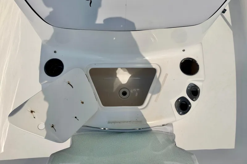 Slide: The Image of 2003 Seaswirl Striper 2101 CC boat interior with open storage compartment and cup holders. - 24