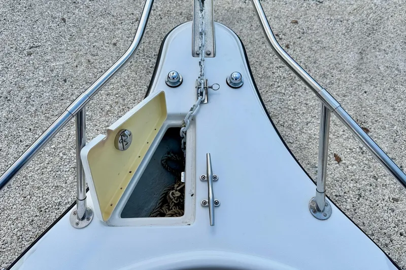 Slide: The Image of Bow of 2003 Seaswirl Striper 2101 CC with anchor storage open. - 26