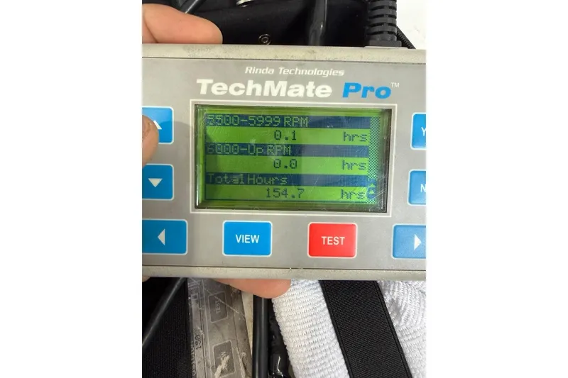 Slide: The Image of TechMate Pro displaying engine hours for 2003 Seaswirl Striper 2101 CC boat. - 30