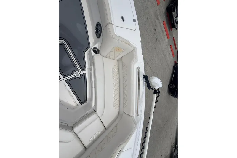 Slide: The Image of 2021 Blue Wave 2800 Makaira boat interior with white seating and deck details. - 12