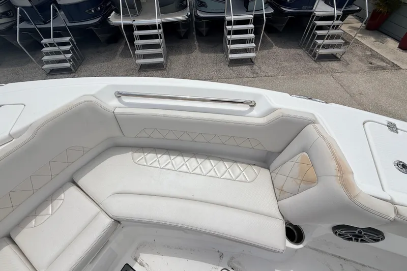 Slide: The Image of Interior view of 2021 Blue Wave 2800 Makaira boat with white cushioned seating. - 13