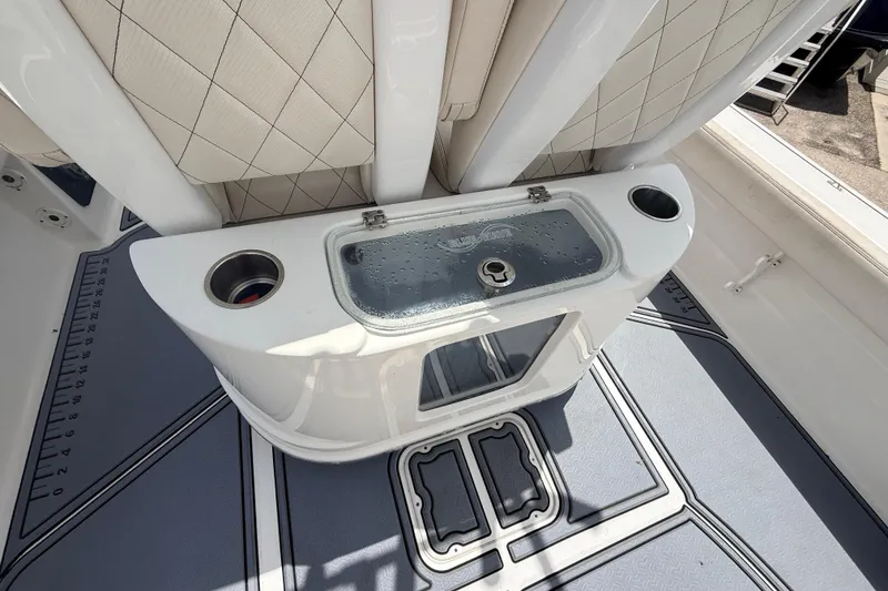 Slide: The Image of 2021 Blue Wave 2800 Makaira boat interior with seating and storage compartments. - 15