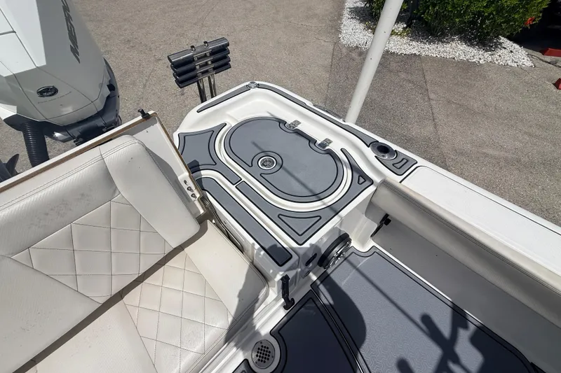 Slide: The Image of 2021 Blue Wave 2800 Makaira boat interior with seating and storage compartments. - 17