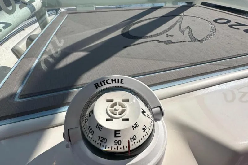 Slide: The Image of Compass on 2023 Sailfish 220 CC boat dashboard, featuring Ritchie brand. - 12