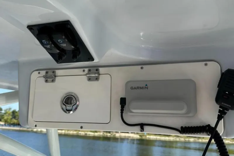 Slide: The Image of 2023 Sailfish 220 CC boat console with Garmin electronics and control panel. - 16