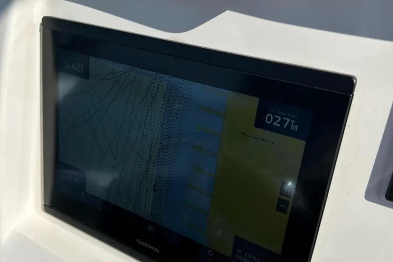 Slide: The Image of Garmin navigation display on 2023 Sailfish 220 CC boat dashboard. - 19