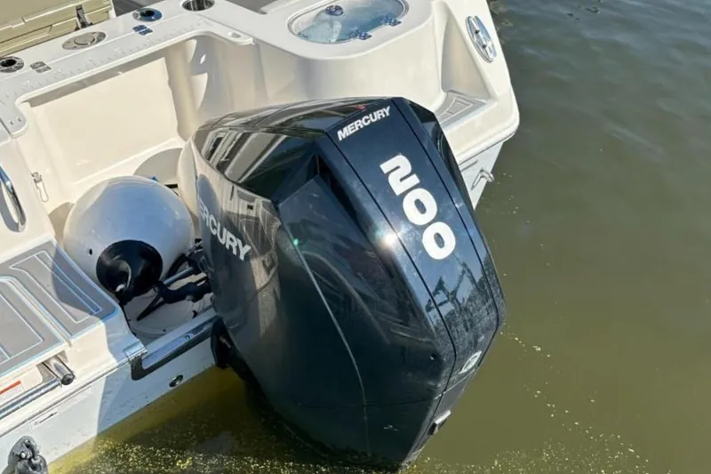 Slide: The Image of 2023 Sailfish 220 CC boat with Mercury 200 outboard motor on water. - 20
