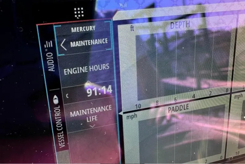 Slide: The Image of Display screen of 2023 Sailfish 220 CC showing engine hours and maintenance data. - 22