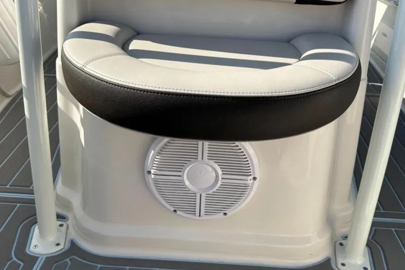 Slide: The Image of 2023 Sailfish 220 CC boat seat with speaker, featuring sleek design and comfortable cushioning. - 6