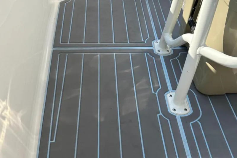 Slide: The Image of 2023 Sailfish 220 CC boat deck with sleek, modern design and durable flooring. - 8