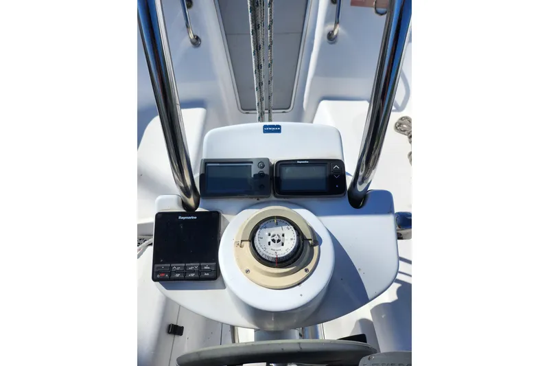 Slide: The Image of Cockpit of 2005 Hunter 27 sailboat with navigation instruments and compass. - 12