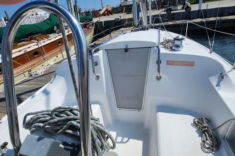Slide: The Image of Cockpit of a 2005 Hunter 27 sailboat docked at a marina. - 15