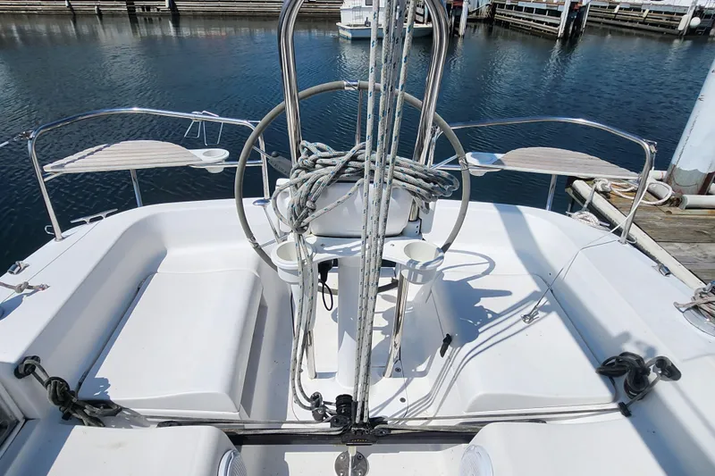 Slide: The Image of Cockpit of a 2005 Hunter 27 sailboat docked at a marina. - 18