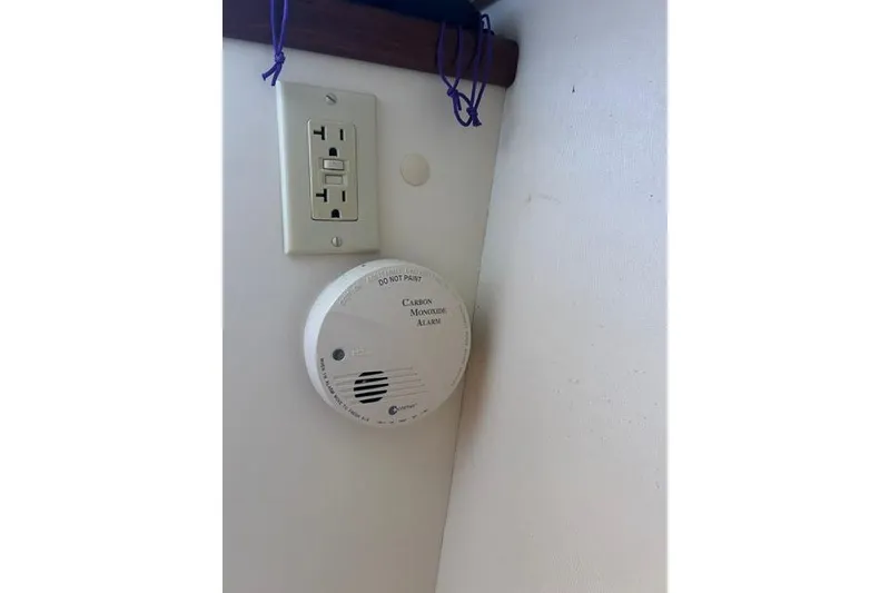 Slide: The Image of Carbon monoxide alarm and outlet on a Hunter 27, 2005 model boat interior. - 32