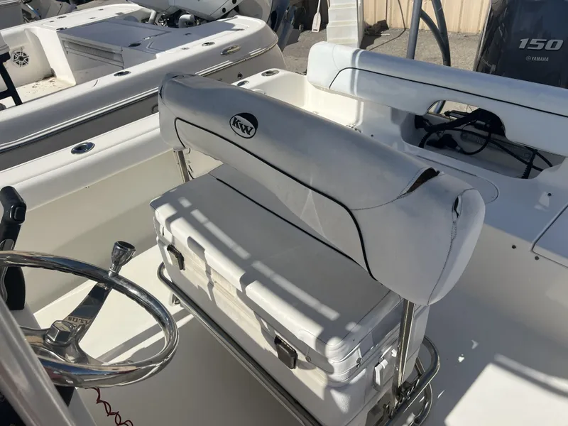 Slide: The Image of Interior of a 2013 Key West 189 FS boat with helm and seating. - 7