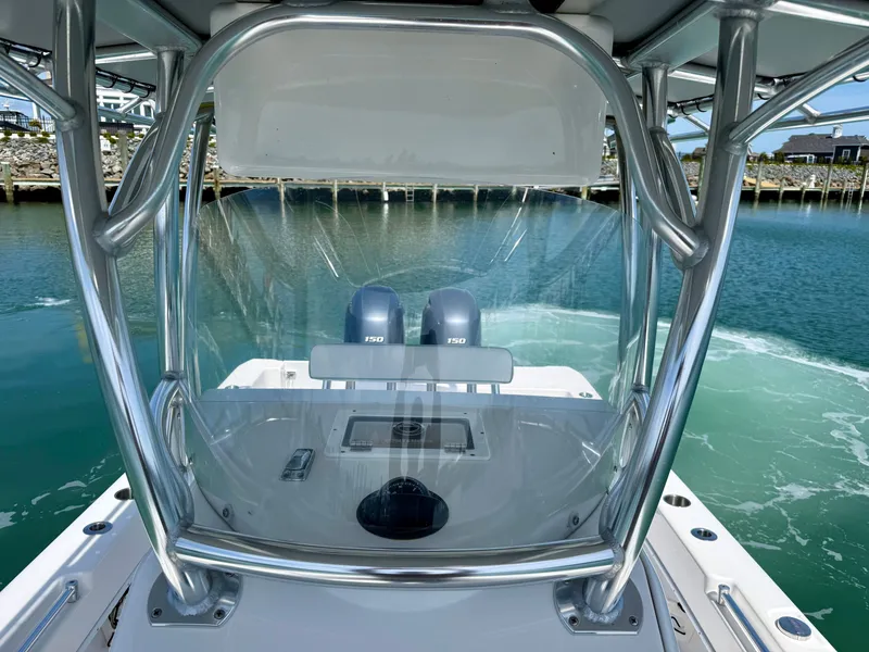 Slide: The Image of 2021 Contender 25 Tournament boat on calm water. - 12
