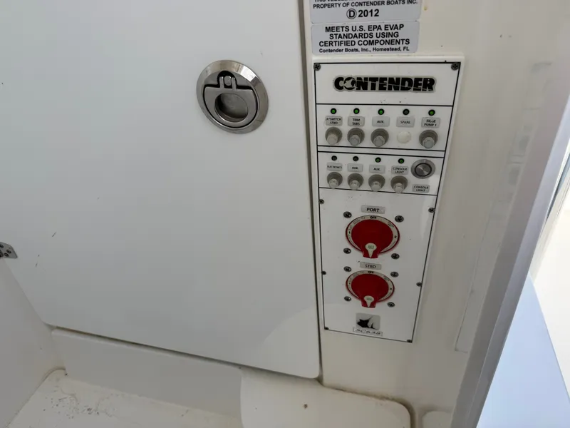 Slide: The Image of Control panel of a 2021 Contender 25 Tournament boat. - 15