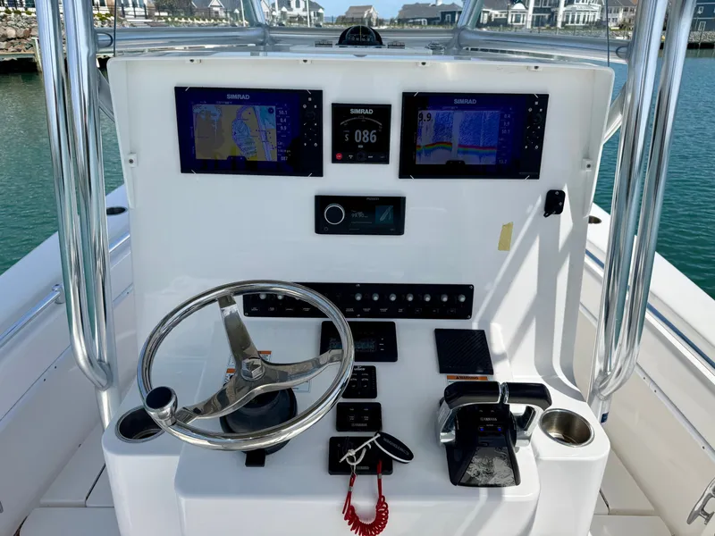 Slide: The Image of Helm console of a 2021 Contender 25 Tournament boat with Simrad displays. - 18