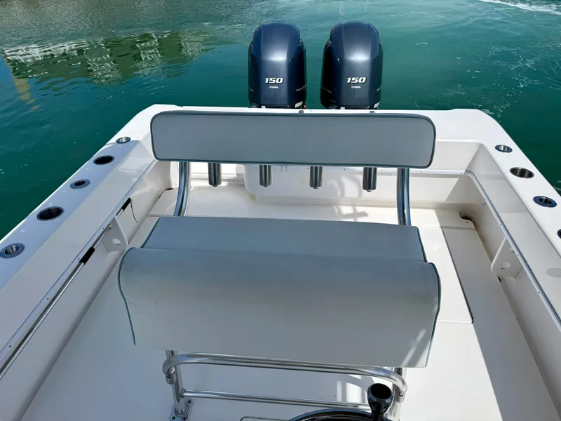 Slide: The Image of Contender 25 Tournament 2021 with twin outboard engines on calm water. - 20