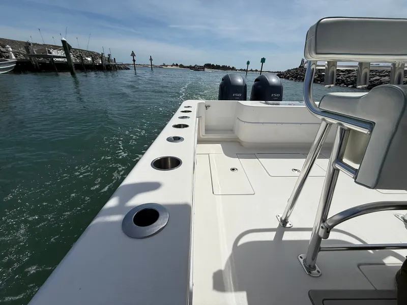 Slide: The Image of Contender 25 Tournament 2021 boat on calm waters. - 21