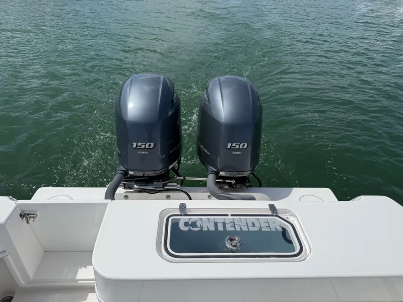 Slide: The Image of Contender 25 Tournament 2021 with twin Yamaha 150 HP outboard engines. - 24