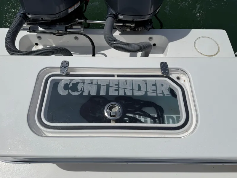 Slide: The Image of Contender 25 Tournament 2021 boat with engines and logo. - 25