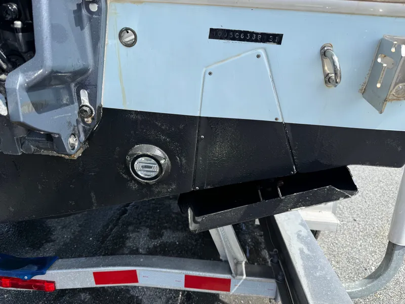 Slide: The Image of Rear view of a 2021 Contender 25 Tournament boat on a trailer. - 28